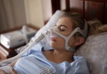 Cpap for Sleep Apnea on Woman in Bedroom