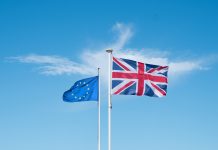 A European and English flag that flies at the top of a mast