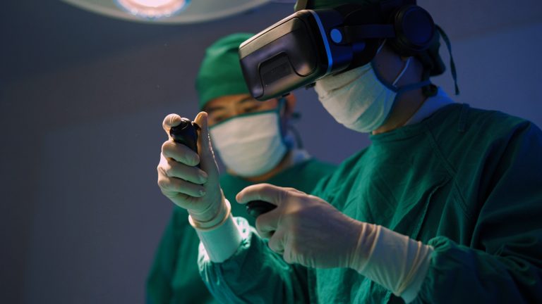 Professional surgeons in uniform and VR headset performing operation on patient in modern clinic
