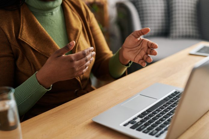 Hands of young female psychoanalyst explaining something to patient