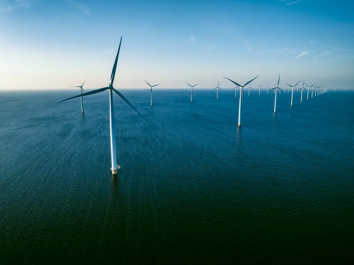 Wind turbines in an offshore wind park producing energy
