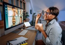 businesswoman having video call while working from home office