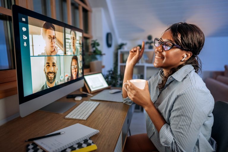 businesswoman having video call while working from home office