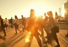 Business Commuters Walking Home After Work, Sunset Backlit, Blurred Motion