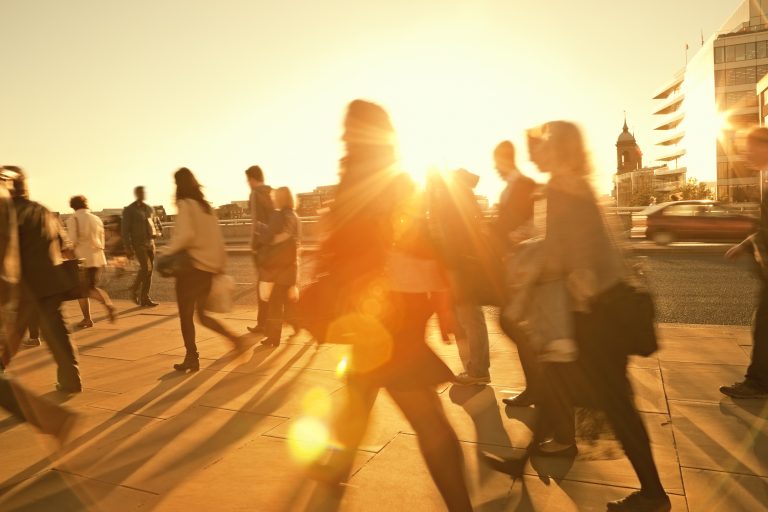 Business Commuters Walking Home After Work, Sunset Backlit, Blurred Motion