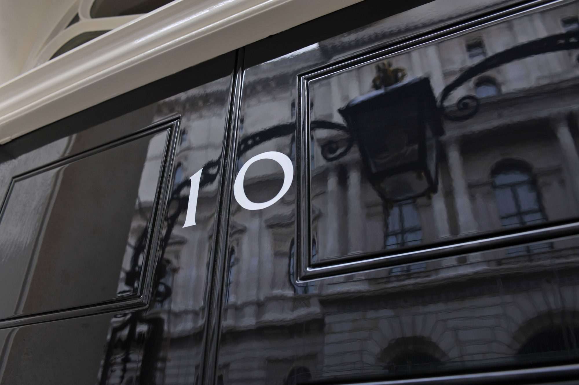 London, UK - January 4th 2004:Close up detail (picking up reflections) of the front door of number ten Downing Street, official office and HQ of the British Prime Minister