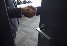 Handshake in office meeting room