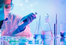 Chemistry Laboratory - Woman With Pipettes And Test Tubes