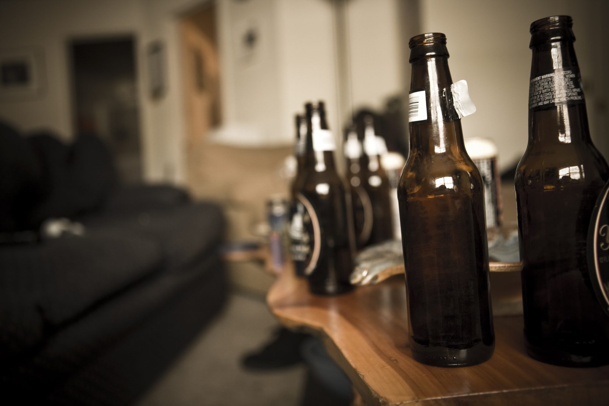 Bottles of beer on table in living room