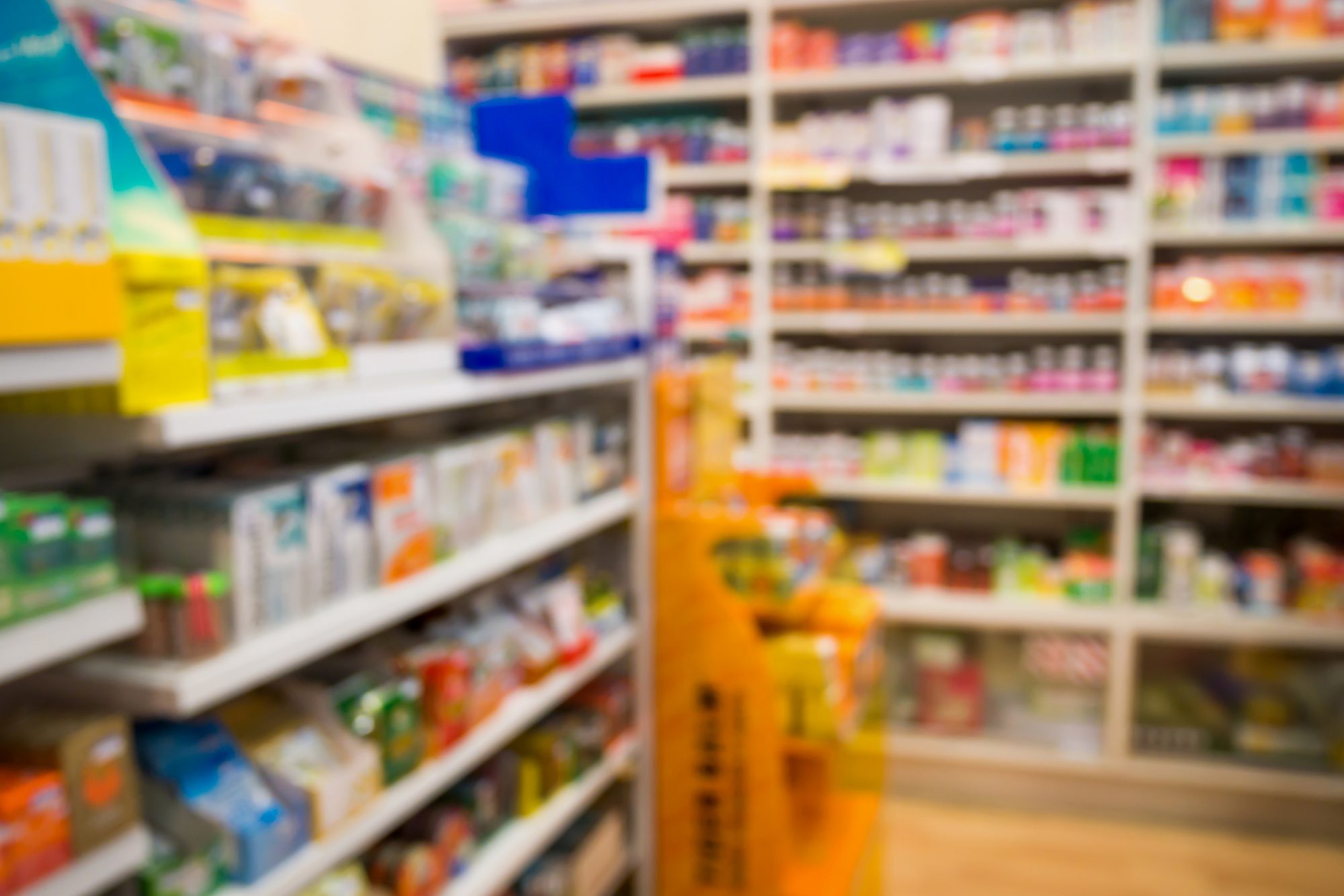 Pharmacy drug store interior blurred background with medicine on shelves