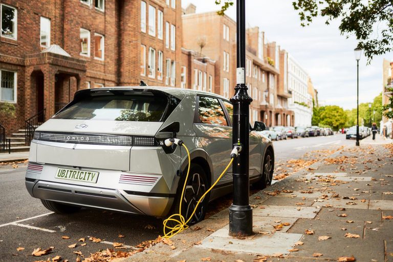 Electric Car Charging At Power Station