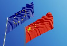 European Union and Chinese flags are waving with wind over blue sk, fostering international collaboration and personalised medicine