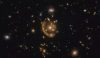 An image of a galaxy being smeared around a gravitational lens creating one of the most complete Einstein rings ever seen, as captured by the Hubble Space Telescope. (Image credit: ESA/Hubble & NASA, S. Jha Acknowledgement: L. Shatz)