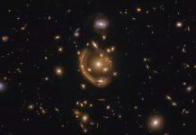 An image of a galaxy being smeared around a gravitational lens creating one of the most complete Einstein rings ever seen, as captured by the Hubble Space Telescope. (Image credit: ESA/Hubble & NASA, S. Jha Acknowledgement: L. Shatz)