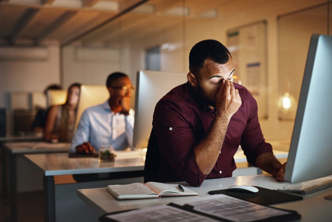 man at his workplace with a lot of stress