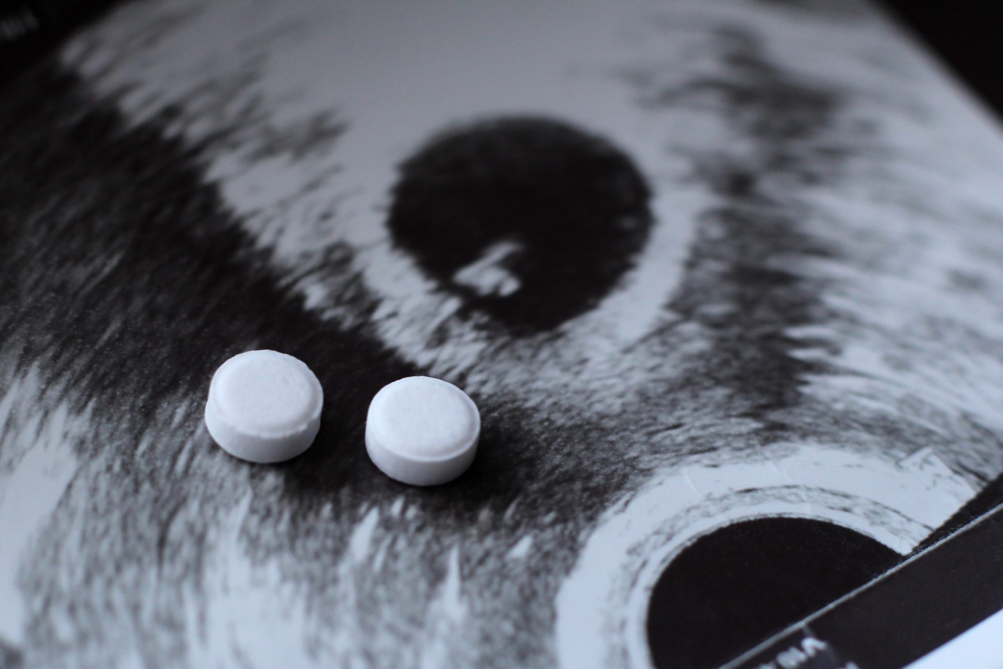 Ultrasound of a pregnant woman and pills medication