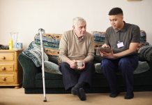 senior man with care worker at home