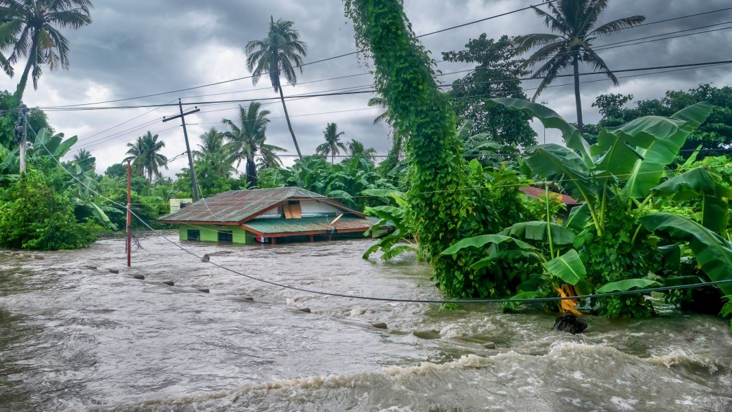 Rising water levels submerging a house as heavy monsoon rains cause major floods in Baco, Oriental Mindoro, Philippines on July 23, 2021.