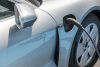 Istanbul, Turkey - April 21, 2021: The electric car is being charged in Istanbul, Turkey. Eco-friendly sustainable energy concept.