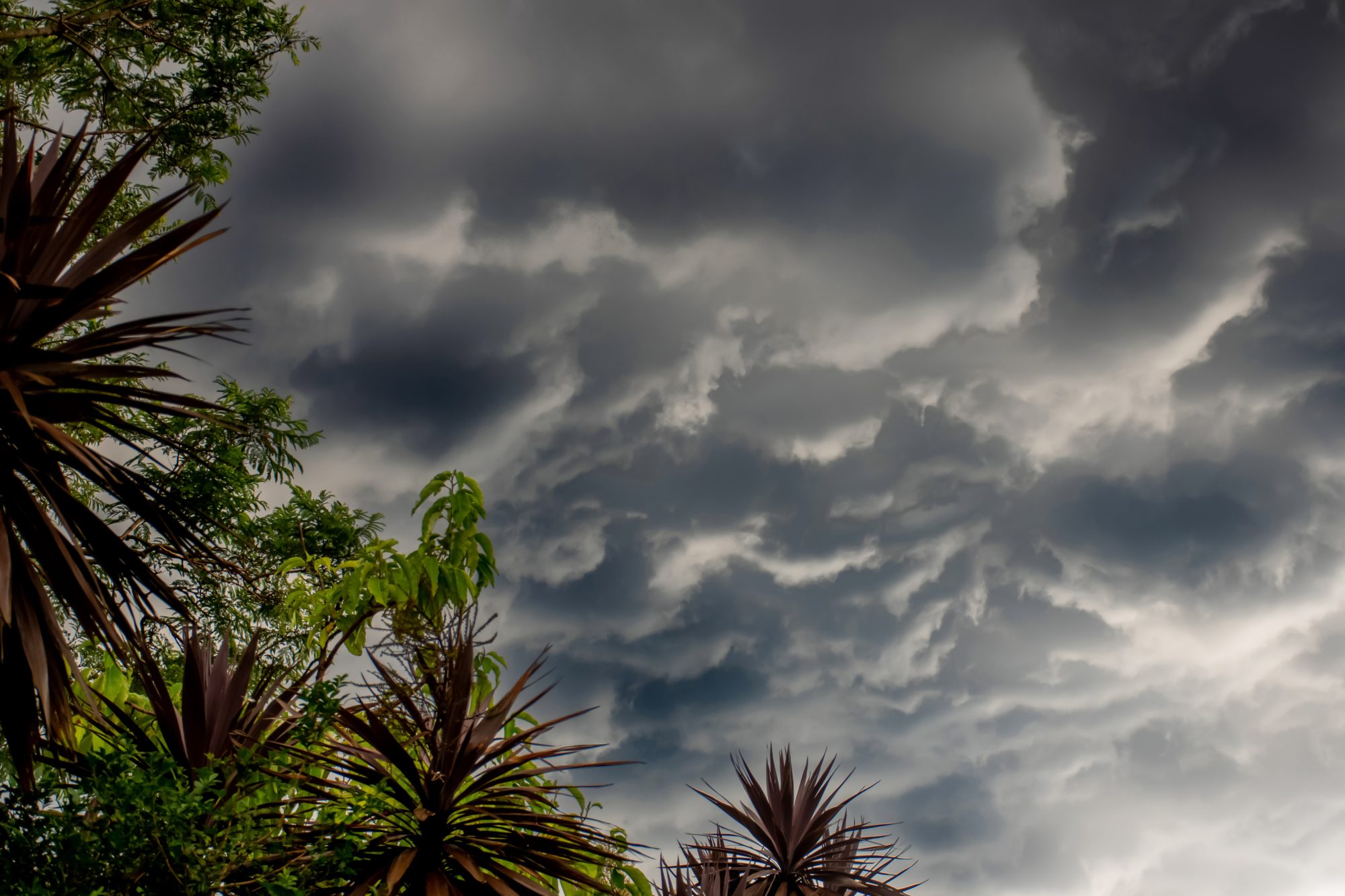 Storm clouds, heavy torrential rain and flash flooding brought on by La Niña