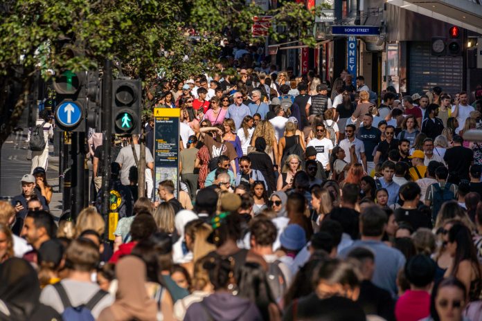 London United Kingdom Crowded city streets in London on a hot summer day near the Bond street Underground entrance