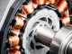 Detail of copper winding, stack and shaft of a electric permeant magnet motor for home appliances. Selective focus and white background.