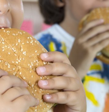 Boy And Girl With Hamburgers. "the t-shirt painted by himself"