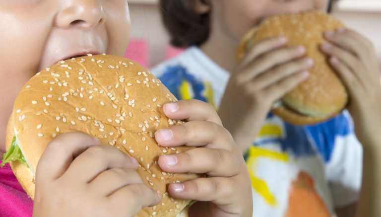 Boy And Girl With Hamburgers. 