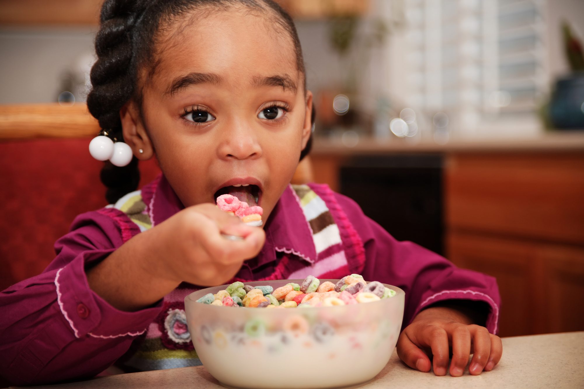 Little Girl Eating Cereal