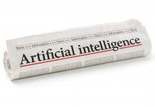 Rolled newspaper with the headline Artificial intelligence