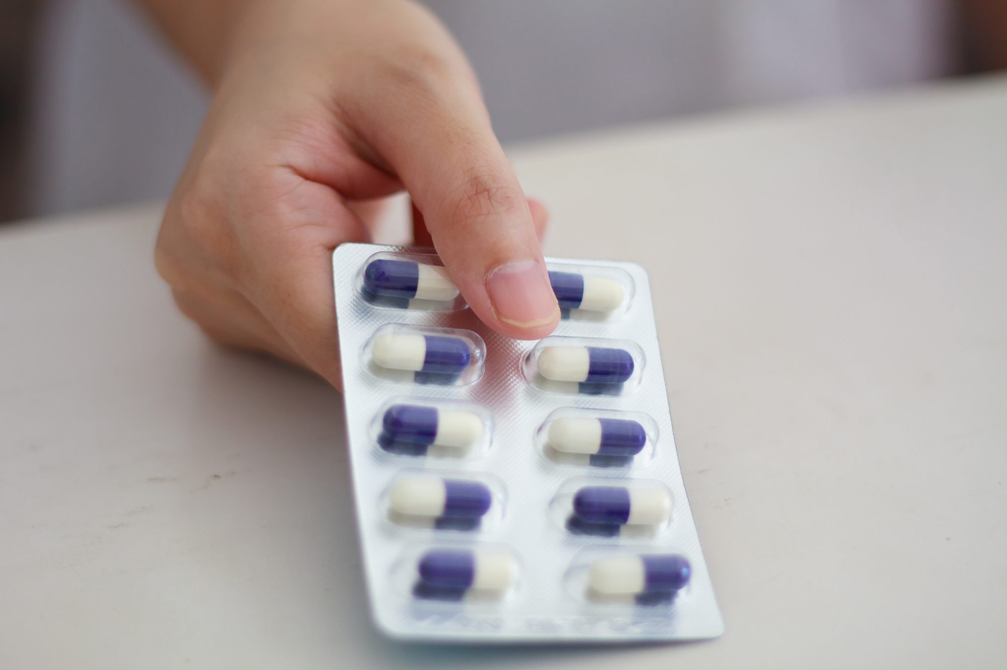 Close up of female doctor hands holding pills