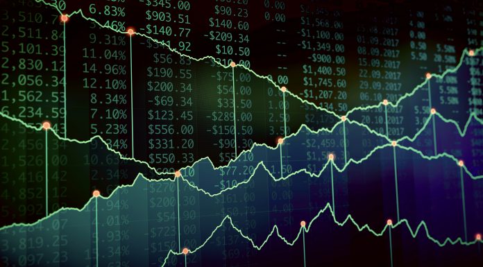 An abstract financial chart showing several projected income lines plotted on a dark background.