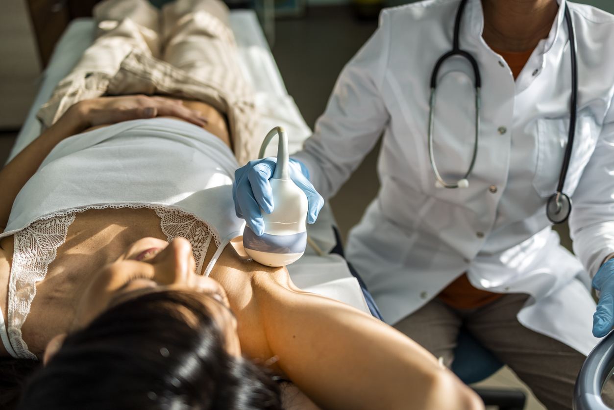 Nurse doing breast examination