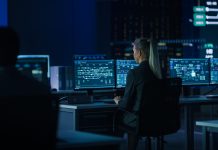 Computer Science Female Engineer Working under Important Project on Personal Computer Showing Infrastructure Infographics and Data.Telecommunications Control Monitoring Room with People Working.