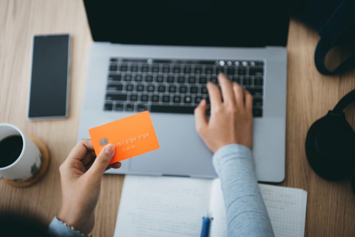 women doing her finances on card