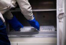 Vaccine Being Removed from a medical Fridge