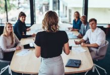 Businesswoman addressing a meeting in office