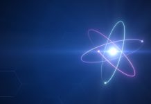 Unstable Atom nucleus with electrons spinning around it technology background