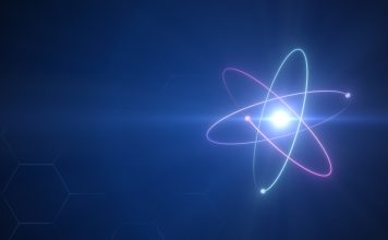 Unstable Atom nucleus with electrons spinning around it technology background