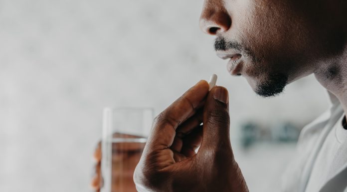 Man medicating himself at home medicine