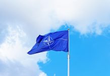 Vilnius, Lithuania - September 3, 2015: NATO flag waving by the wind