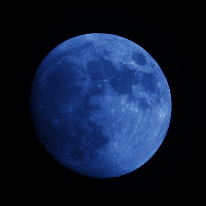 Close up of a super resolution blue full moon at night sky