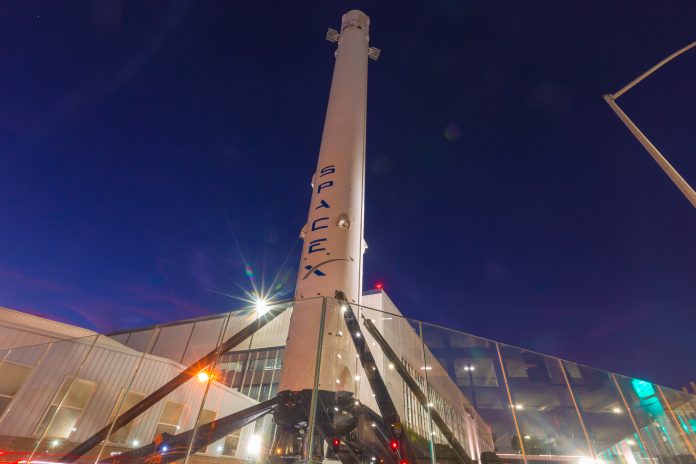 Hawthorne CA USA: August 24 2018: SpaceX designs, manufactures and launches advanced rockets and spacecraft. The company was founded in 2002 to revolutionize space technology, with the ultimate goal of enabling people to live on other planets. Falcon 9 is a two-stage rocket designed and manufactured by SpaceX for the reliable and safe transport of satellites and the Dragon spacecraft into orbit. Falcon 9 is the first orbital class rocket capable of reflight. SpaceX believes rocket reusability is the key breakthrough needed to reduce the cost of access to space and enable people to live on other planets. Falcon 9 was designed from the ground up for maximum reliability. Falcon 9’s simple two-stage configuration minimizes the number of separation events -- and with nine first-stage engines, it can safely complete its mission even in the event of an engine shutdown.