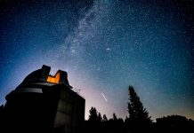 Milky way galaxy over observatory