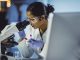 Young Scientist Looking Through a Microscope, STEM education