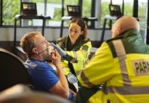 paramedic at scene with older man