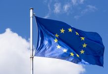EU Flag waving against blue Sky, horison europe funding