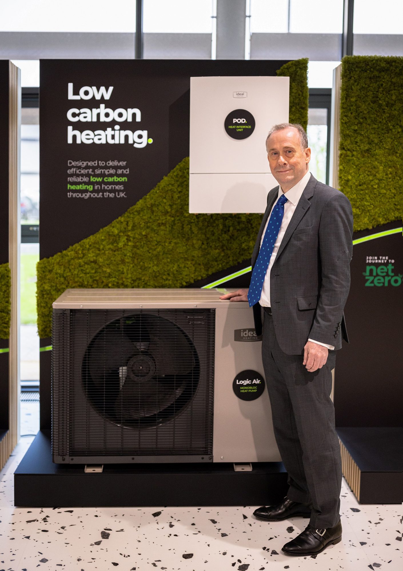 Lord Callanan, Minister for Energy Efficiency and Green Finance, at Ideal Heating’s new £2.2m National Training and Technology Centre with the company’s Logic Air monobloc heat pump.