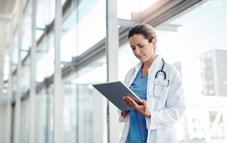 Cropped shot of a female doctor using a digital tablet