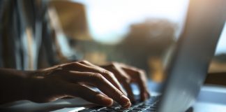 Close up of a hands on a laptop keyboard